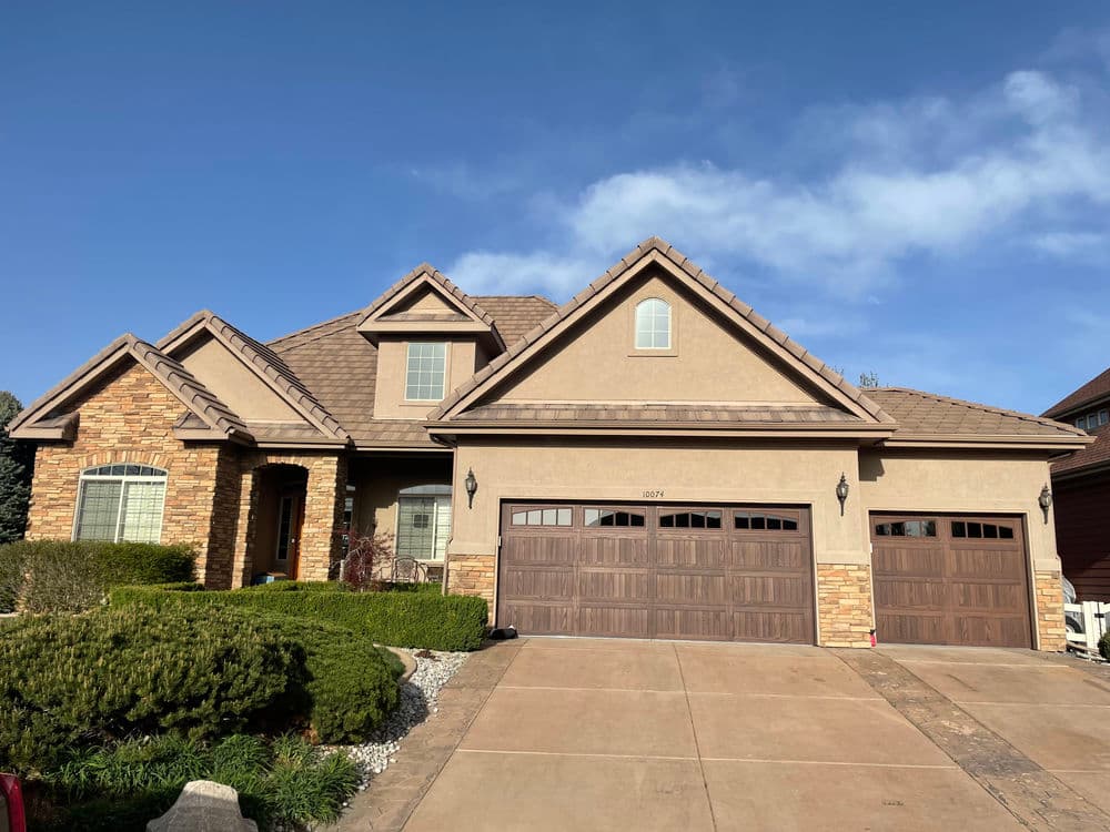 Home with trees and an orange sunset